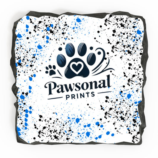 A rectangular personalised photo rock slate featuring a high-resolution printed image, mounted on a natural stone surface with rugged, chiseled edges. The slate is displayed on a black plastic stand, ideal for home or office déco