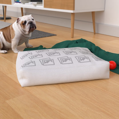 Custom waterproof dog bed placed on a wooden floor, surrounded by pet toys and dog accessories for lifestyle appeal.